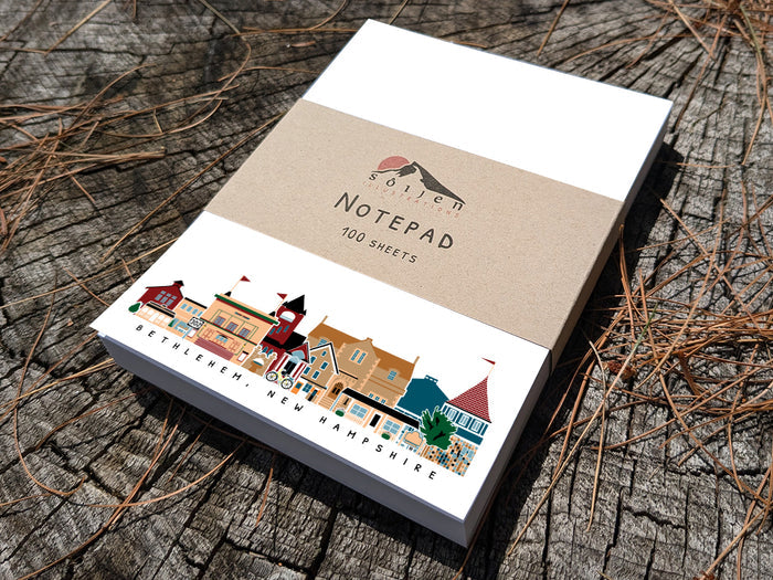 Notepad with Bethlehem New Hampshire cityscape on a wood background