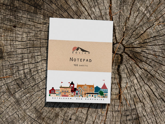 Notepad with Bethlehem New Hampshire cityscape on a wood background