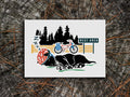 Art print of a black dog sleeping with a helmet on and a bike and trees in the background.