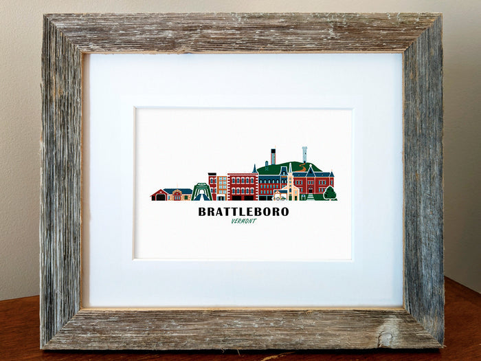 Framed art print of buildings arranged in a skyline with the text Brattleboro Vermont