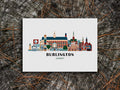 Art print of buildings arranged in a skyline with the text Burlington Vermont