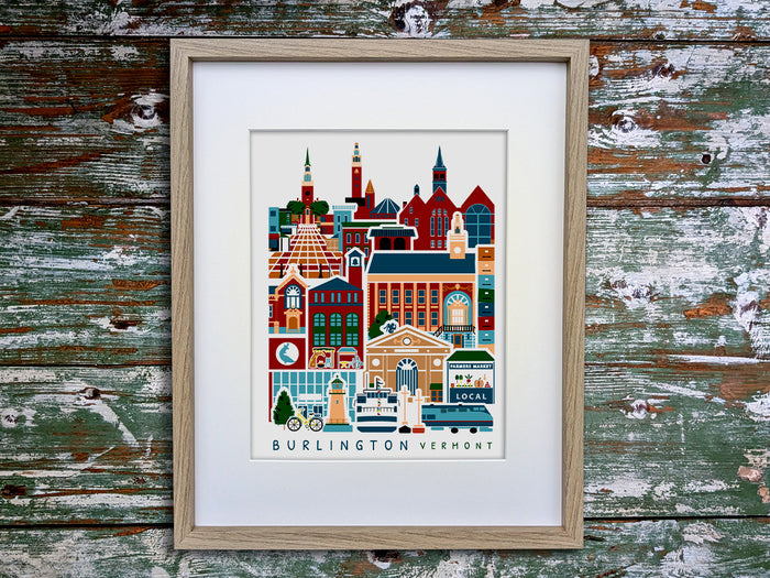 Framed vertical poster with buildings and landmarks in a stacked arrangement with the text Burlington Vermont.