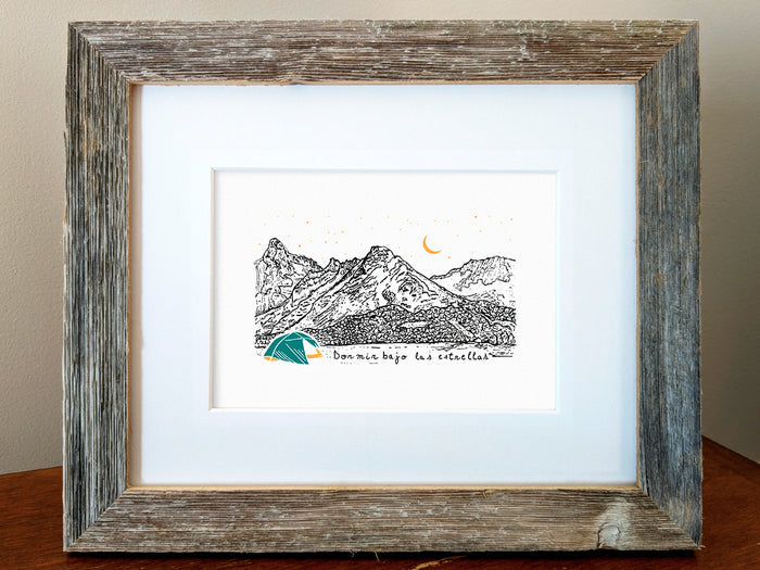 Framed art print of a blue and yellow tent with mountains in the background and the text Dormir bajo las estrellas