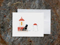 Greeting card with image of a dog in a lighthouse.