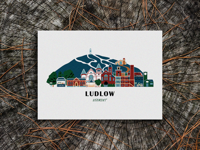 Art print of buildings arranged in a skyline with the text Ludlow Vermont