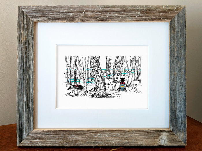Framed print of two black dogs in a forest collecting maple syrup