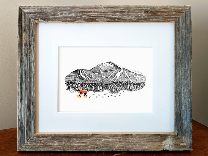 Framed art print of a dog with a red vest and hat snow shoeing with mountains in the background