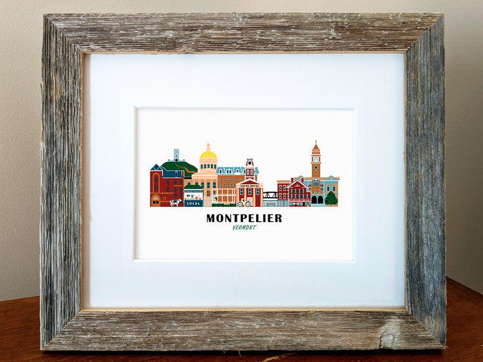 Framed art print of buildings arranged in a skyline with the text Montpelier Vermont