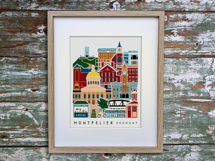 Framed vertical poster with buildings and landmarks in a stacked arrangement with the text Montpelier Vermont.