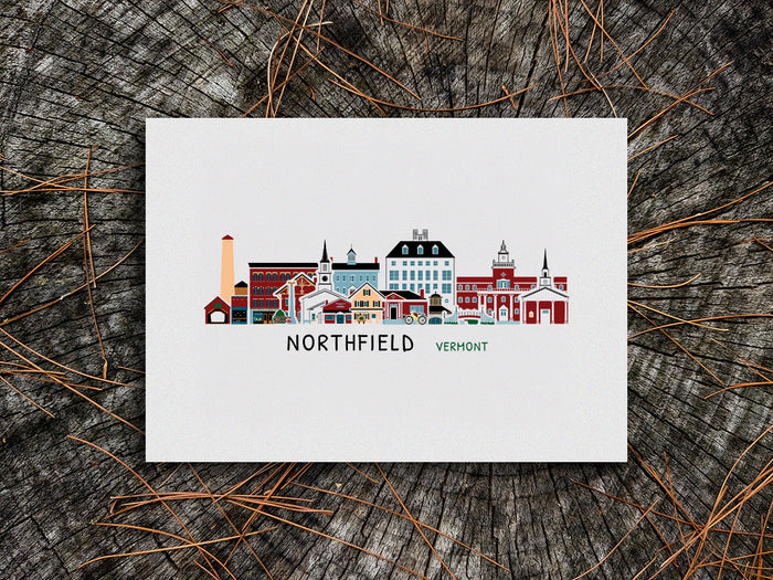 Art print of buildings arranged in a skyline with the text Northfield Vermont