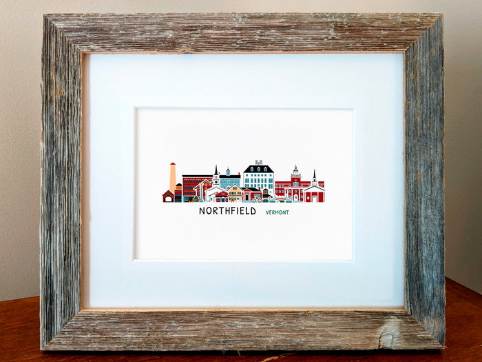 Framed art print of buildings arranged in a skyline with the text Northfield Vermont