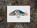 Art print of buildings arranged in a skyline with the text Peru Vermont