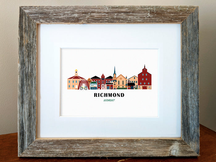 Framed art print of buildings arranged in a skyline with the text Richmond Vermont
