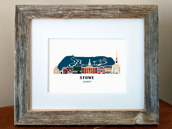 Framed art print of buildings arranged in a skyline with the text Stowe Vermont