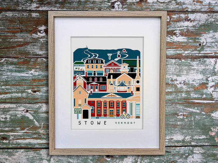Framed vertical poster with buildings and landmarks in a stacked arrangement with the text Stowe Vermont.