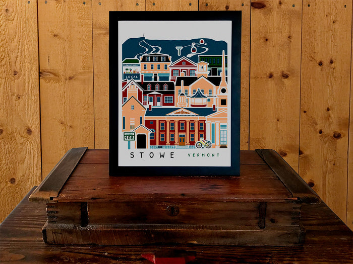 Framed vertical poster with buildings and landmarks in a stacked arrangement with the text Stowe Vermont.