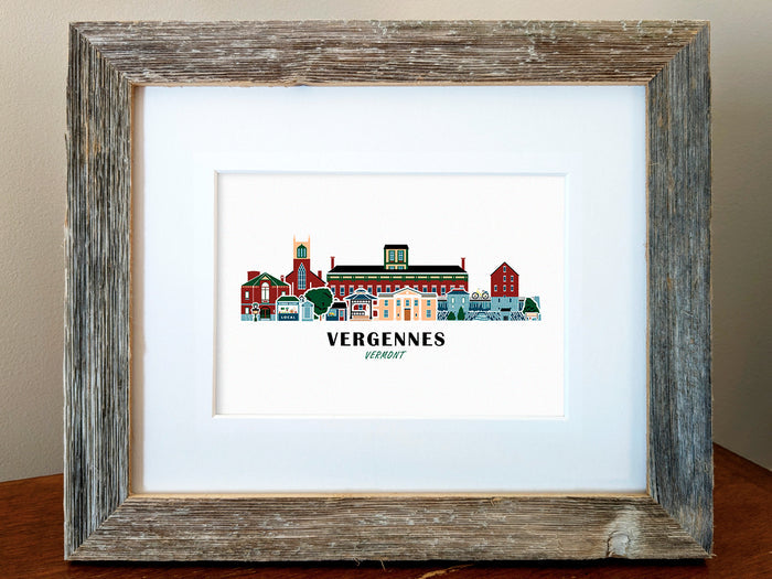 Framed art print of buildings arranged in a skyline with the text Vergennes Vermont