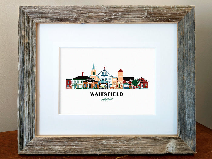 Framed art print of buildings arranged in a skyline with the text Waitsfield Vermont