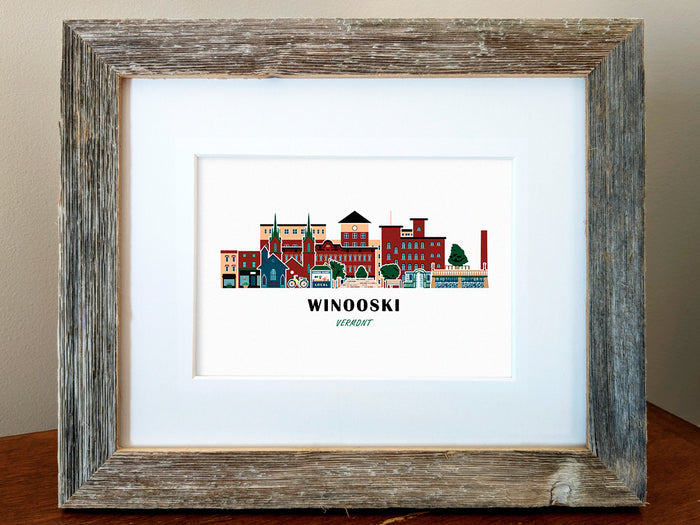 Framed art print of buildings arranged in a skyline with the text Winooski Vermont